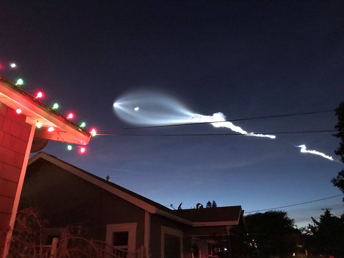 SpaceX's Falcon 9 rocket lifts off in the air, as seen from El Sugundo, California