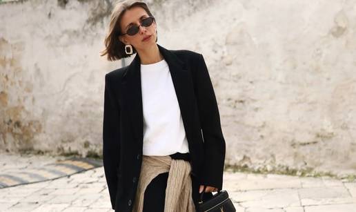 Dugački crni kaput kao simbol elegancije i minimalizma