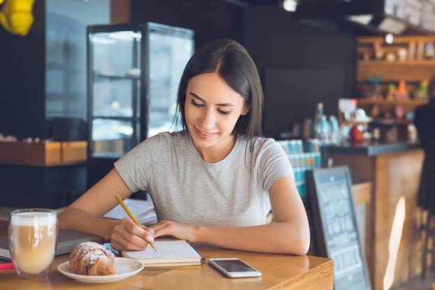  Young woman sitting in a coffee shop leisure