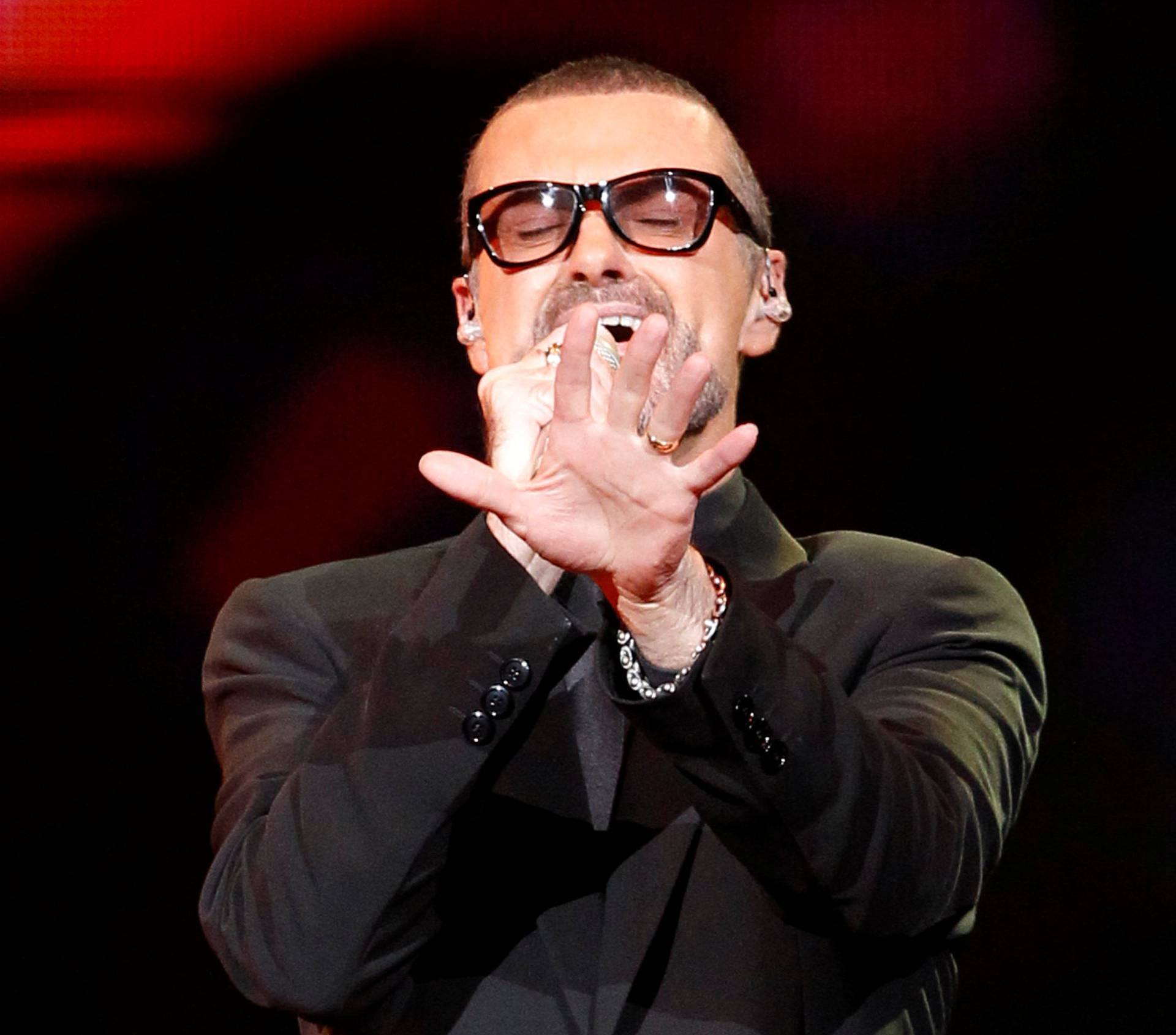 FILE PHOTO British singer George Michael performs on stage during his "Symphonica" tour concert in Berlin