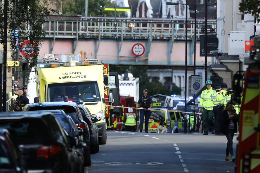 Police, fire and ambulance crew attend to an incident at Parsons Green underground station in London