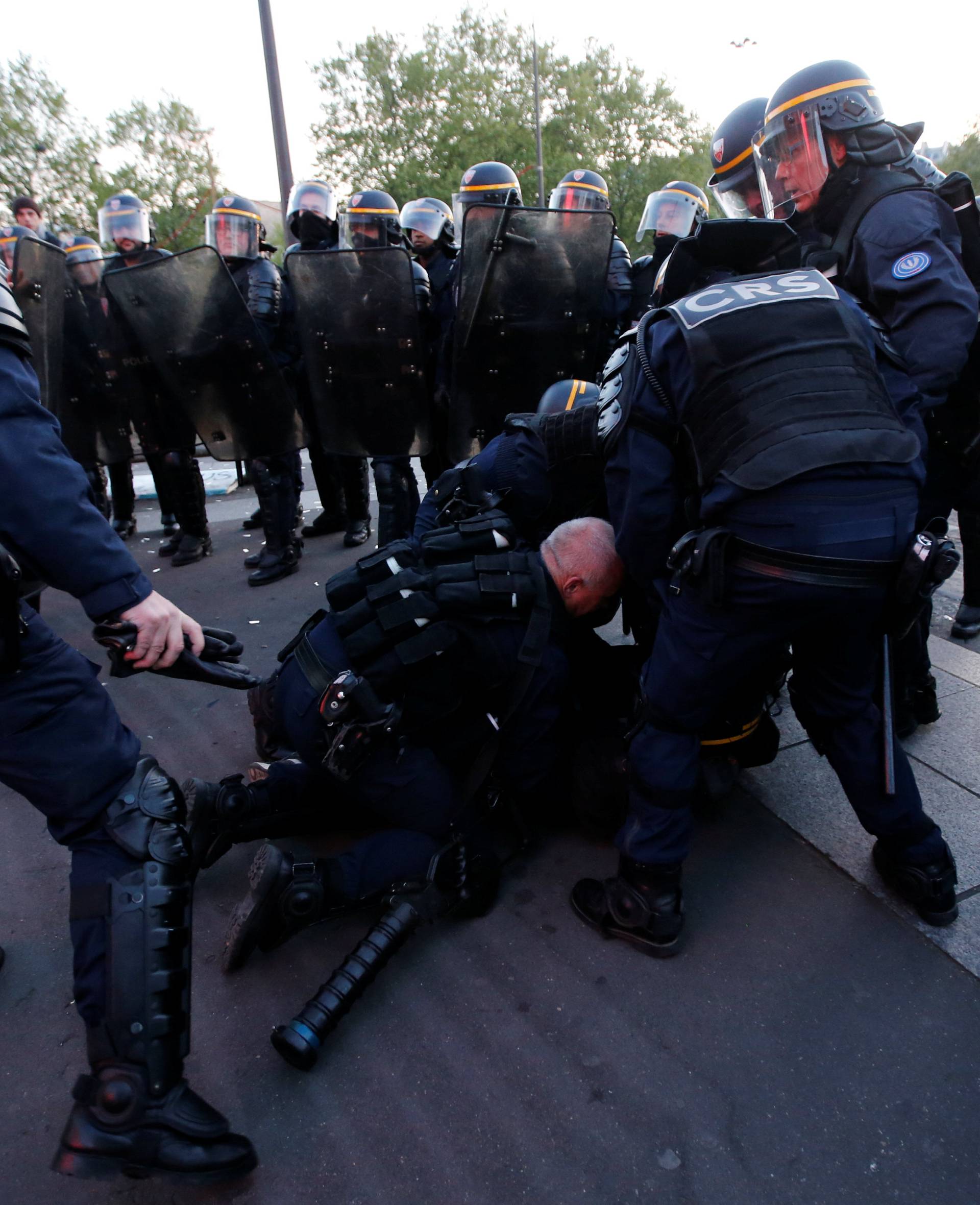 French riot police clash with demonstrators after partial results in the first round of 2017 French presidential election, in Paris