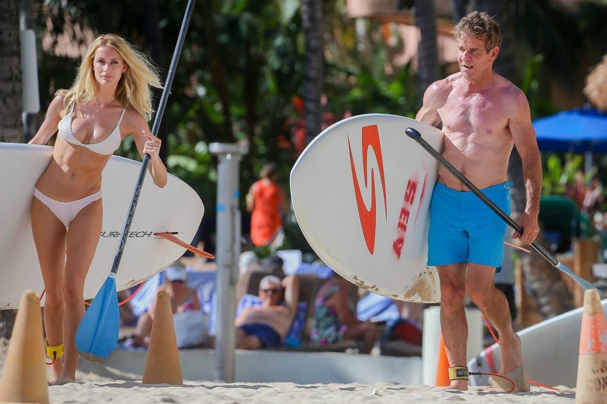 *EXCLUSIVE* A shirtless Dennis Quaid 65, shows off his ripped body while enjoying a beach day with 26 year old girlfriend, Laura Savoie in Hawaii! - ** WEB MUST CALL FOR PRICING **