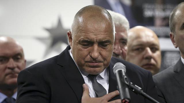 Former Bulgarian prime minister and  leader of centre-right GERB party Boiko Borisov gestures during a news conference at the party's headquarters in Sofia