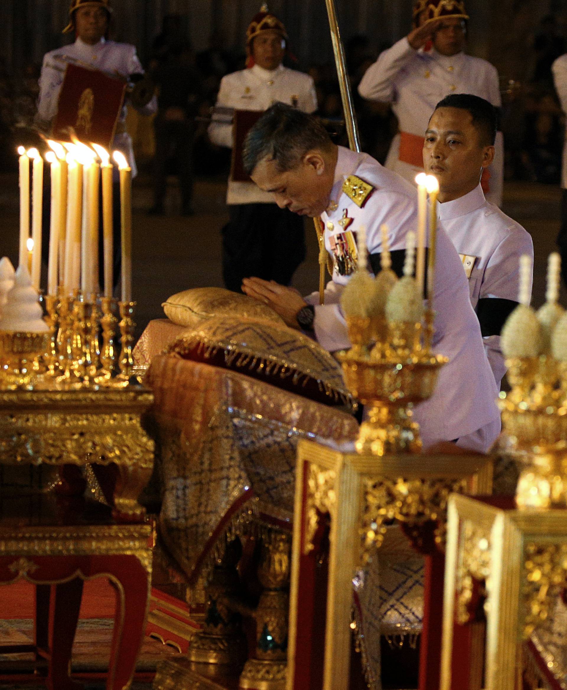 Thailand's Crown Prince Maha Vajiralongkorn attends an event commemorating the death of King Chulalongkorn, known as King Rama V, as he joins people during the mourning of his father, the late King Bhumibol Adulyadej, at the Royal Plaza in Bangkok