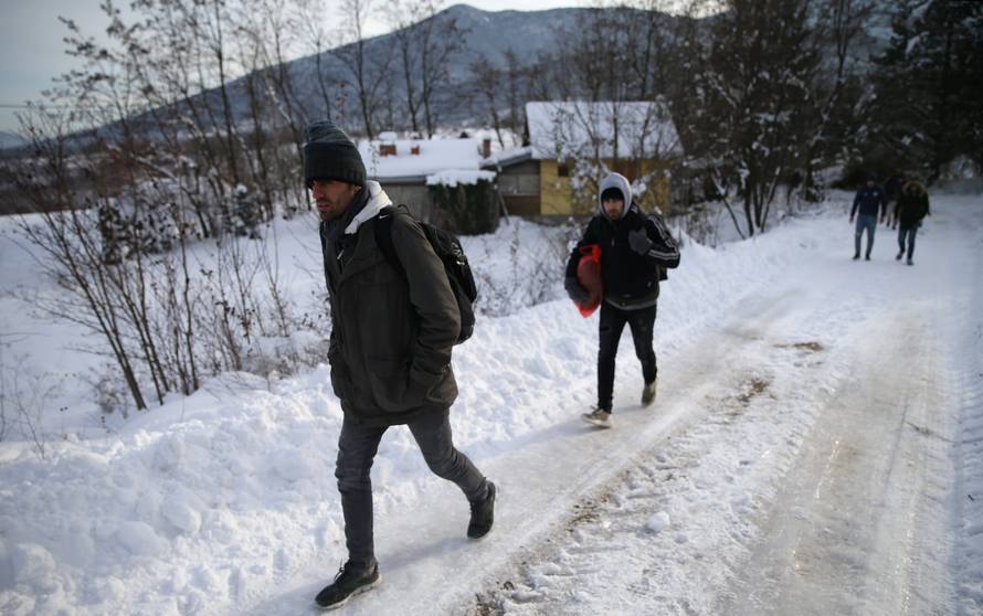 A group of migrants attempts to illegally cross the border into Croatia on the Pljesevica Mountain near Bihac