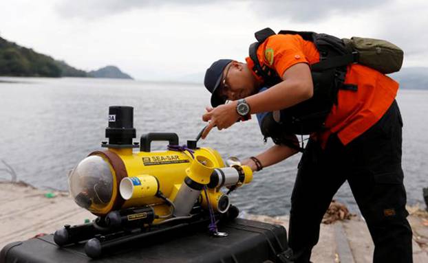 A rescue personnel prepares a ROV before starting to find the location of the Lion Air plane crash in the sea in Karawang regency