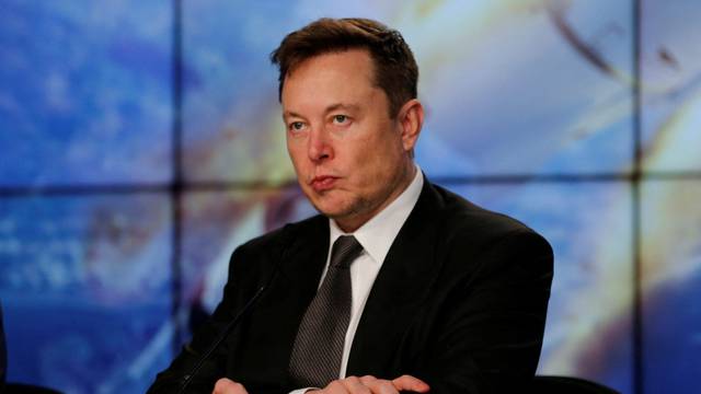 FILE PHOTO: SpaceX founder and chief engineer Elon Musk reacts at a post-launch news conference to discuss the  SpaceX Crew Dragon astronaut capsule in-flight abort test at the Kennedy Space Center