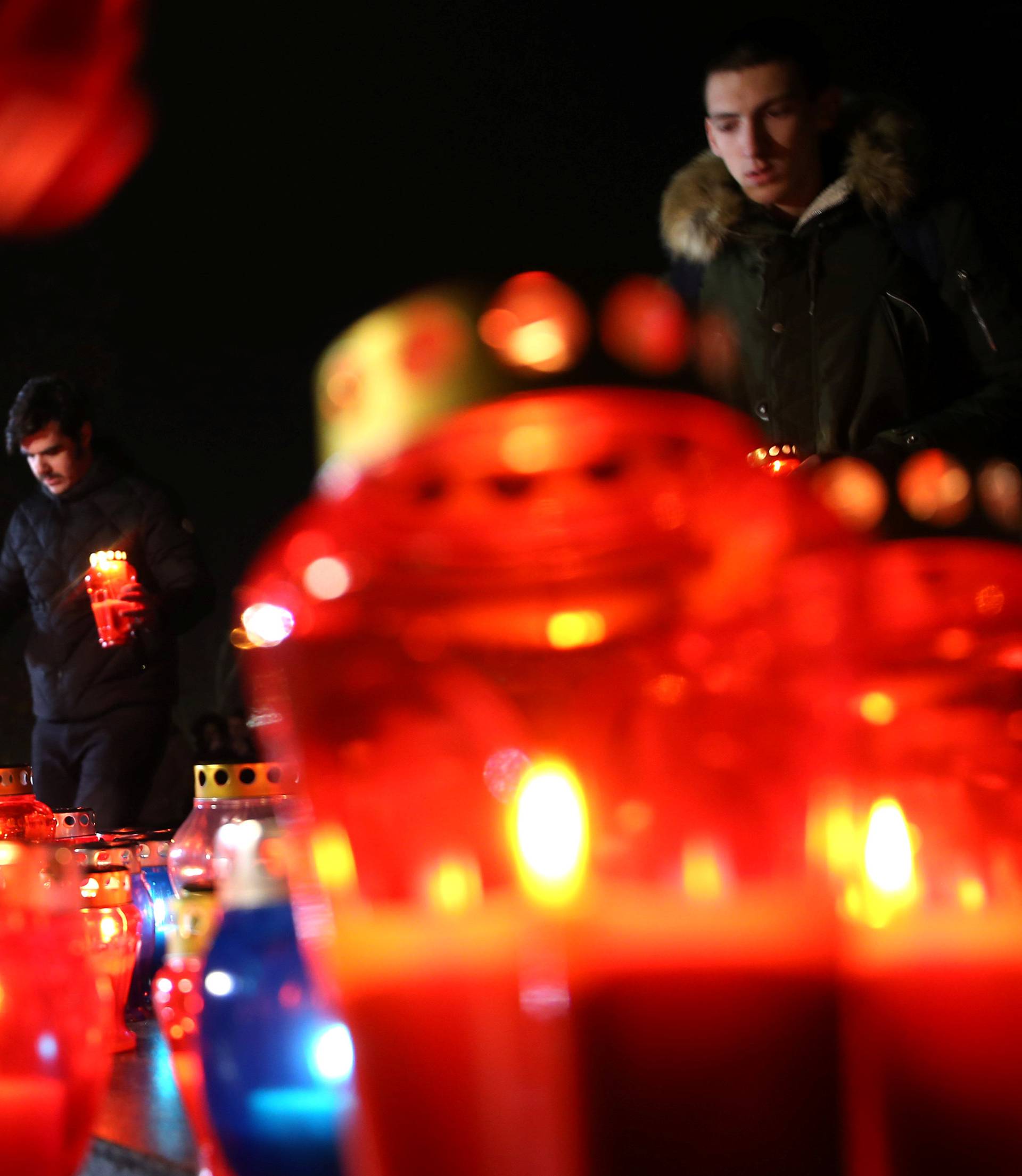 Bosnian Croats pray and light candles for the convicted general Slobodan Praljak, who killed himself seconds after the verdict in the U.N. war crimes tribunal in The Hague, in Mostar