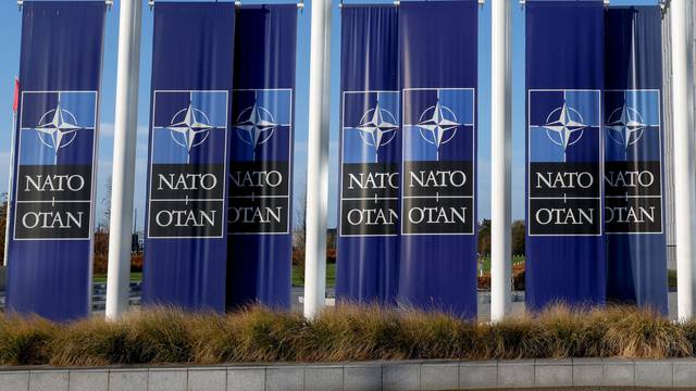 A view shows banners outside NATO headquarters in Brussels