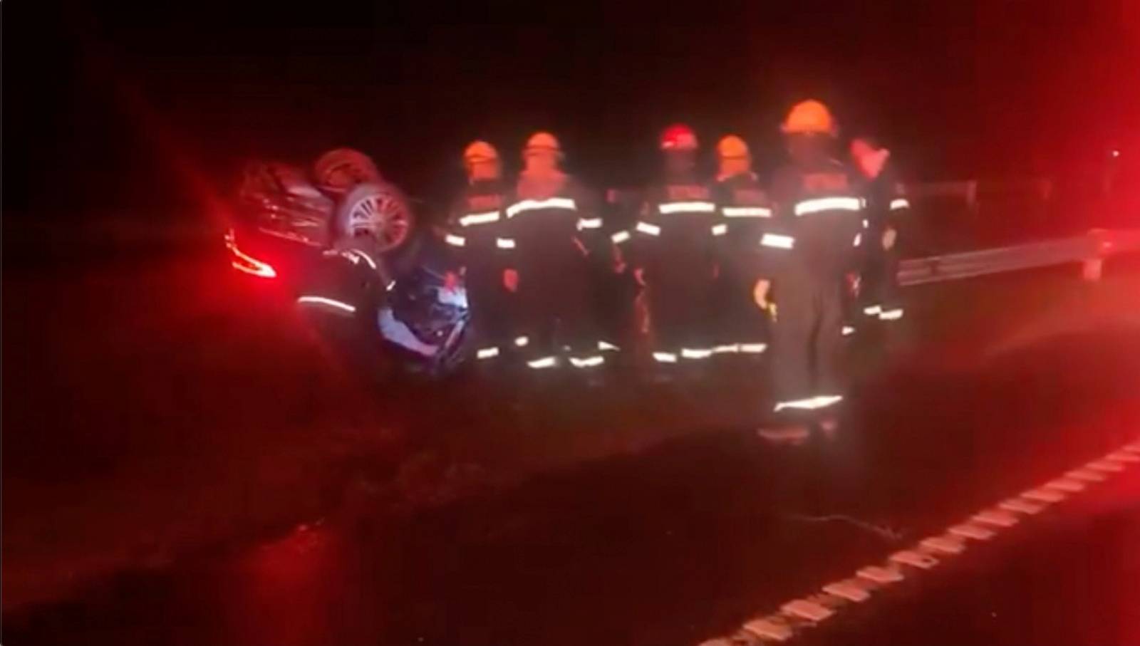 Rescue personnel work at the scene of a traffic accident where Argentina's Transport Minister Mario Meoni died, in San Andres de Giles, Buenos Aires Province