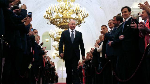 Russian President Putin walks before an inauguration ceremony at the Kremlin in Moscow