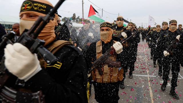 FILE PHOTO: Palestinian Islamic Jihad militants participate in an anti-Israel military parade marking the 36th anniversary of the movement's foundation in Gaza City