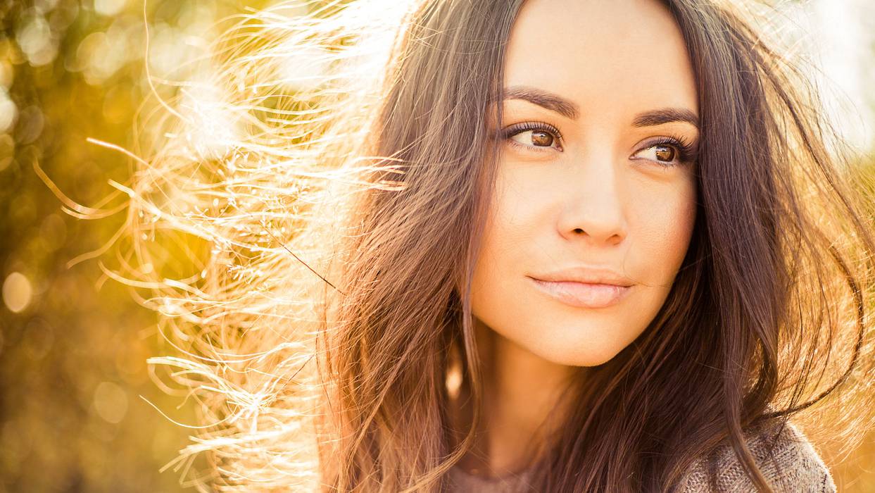 Beautiful lady in autumn landscape