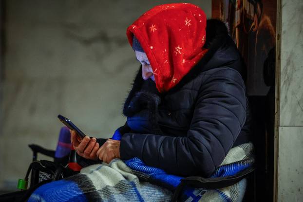 People take shelter inside a metro station during overnight Russian missile and drone attack, in Kyiv