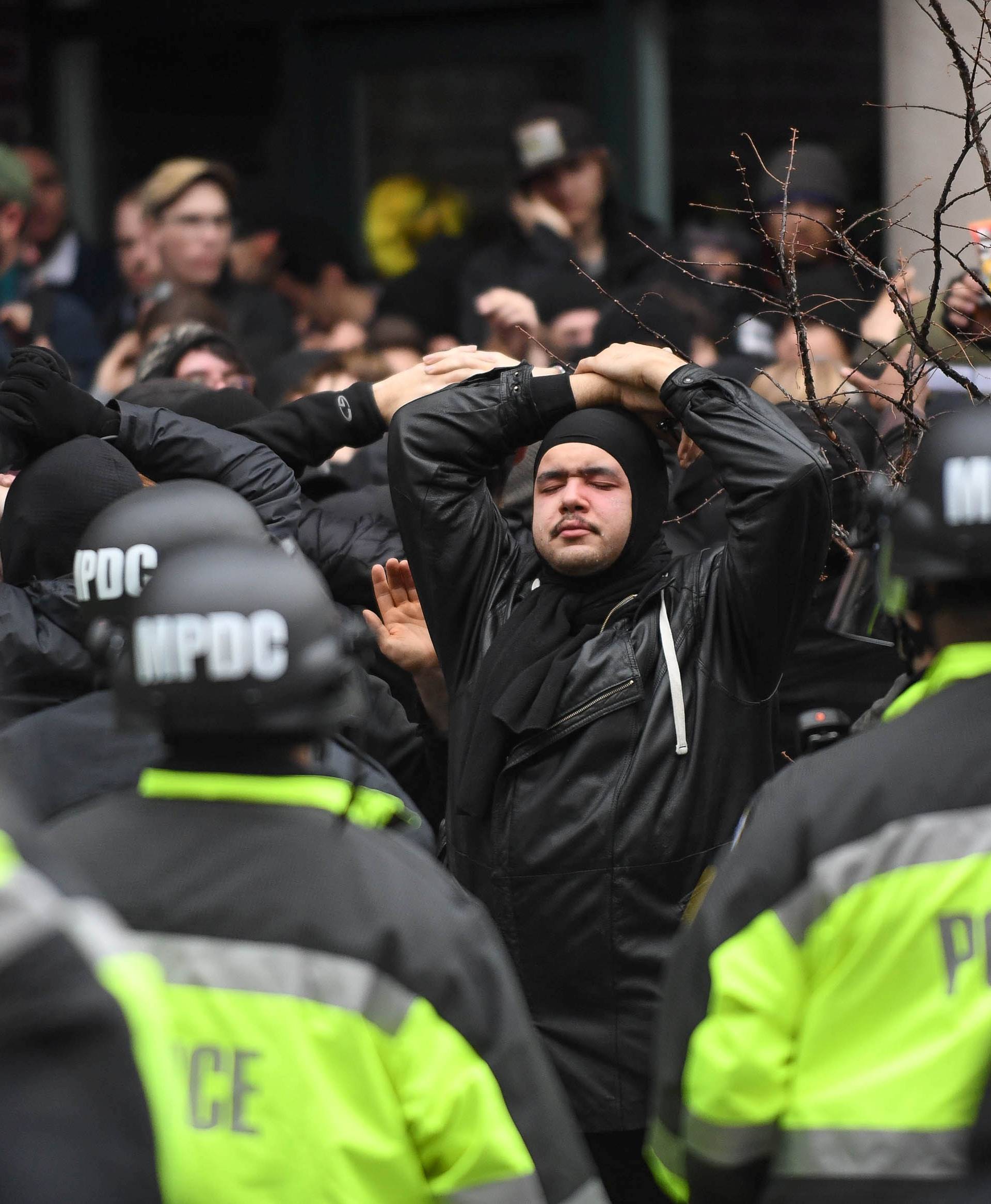 Protesters are surrounded by police during protest near the inauguration of President-elect Donald Trump in Washington