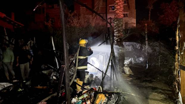 Aftermath of an Israeli strike on tents of displaced people, in Deir Al-Balah