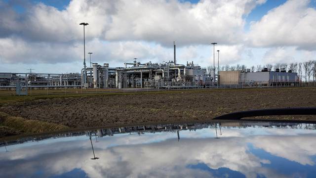 FILE PHOTO: A view of a gas production plant is reflected in the roof of a car in 't Zand in Groningen