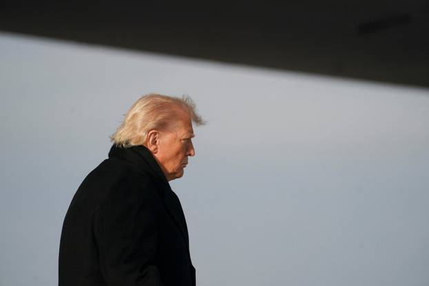 U.S. President Donald Trump participates in a dignified transfer of the remains of two Iowa National Guard members, in Dover