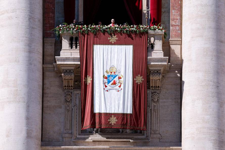 Pope Leo XIV delivers his "Urbi et Orbi" (To the city and the world) message from the main balcony of St. Peter's Basilica