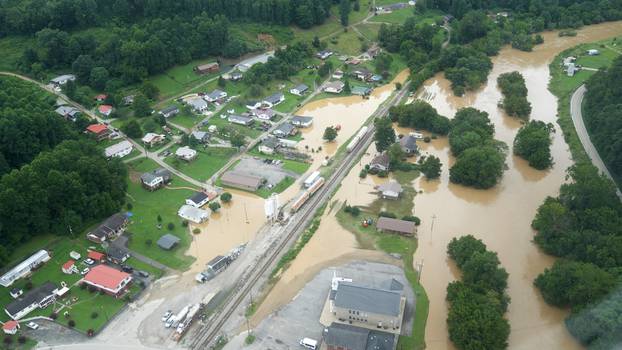 A valley lies flooded as seen from a helicopter during a tour by Kentucky Governor Andy Beshear