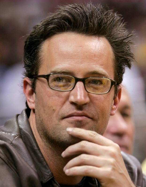 FILE PHOTO: Actor Matthew Perry watches NBA game between Los Angeles Lakers and Denver Nuggets in Los Angeles