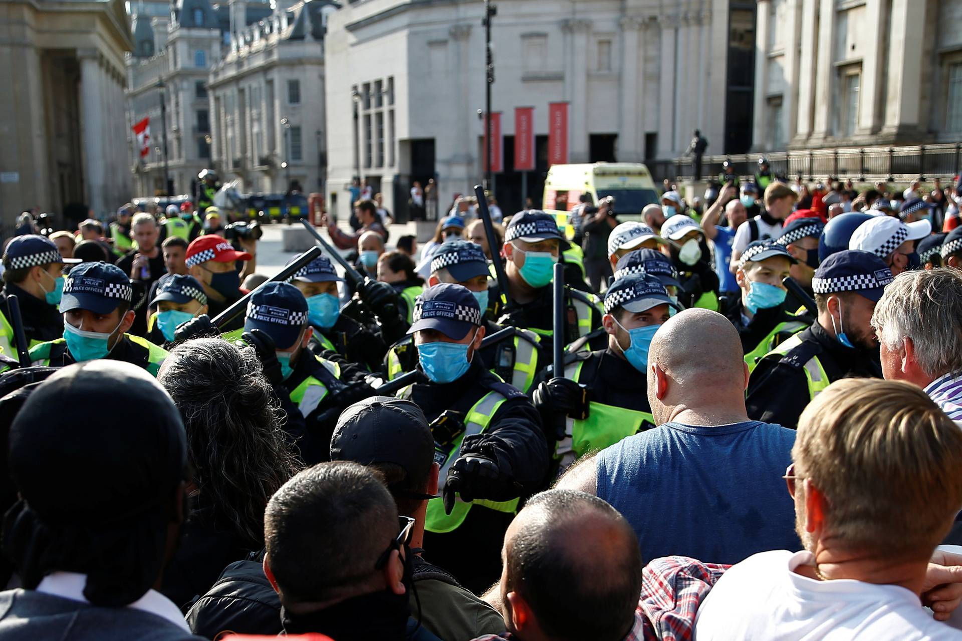People gather in Trafalgar Square to protest against the lockdown imposed by the government, in London