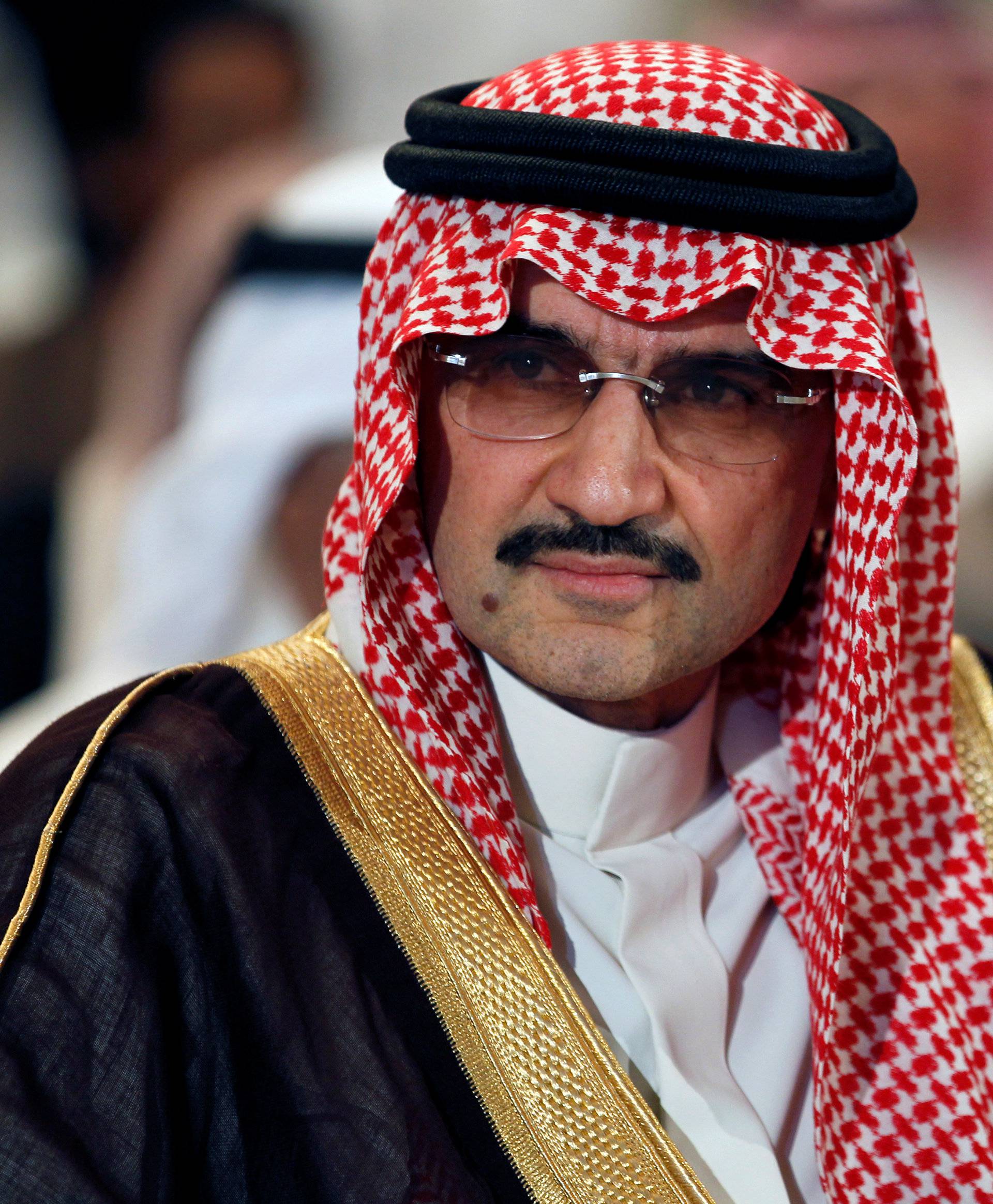 FILE PHOTO - Saudi billionaire Prince AlWaleed bin Talal looks on during a news briefing in Manama
