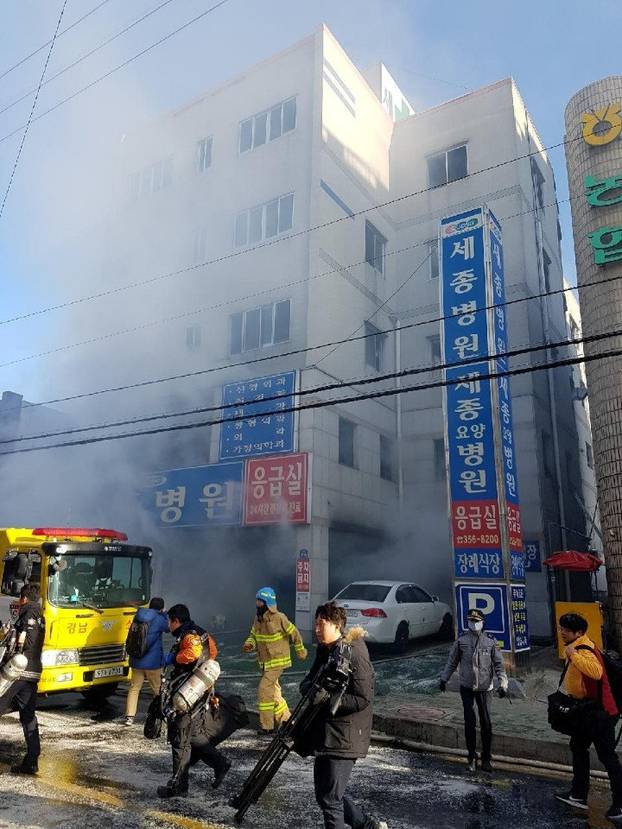 Smoke rises from a burning hospital in Miryang, South Korea