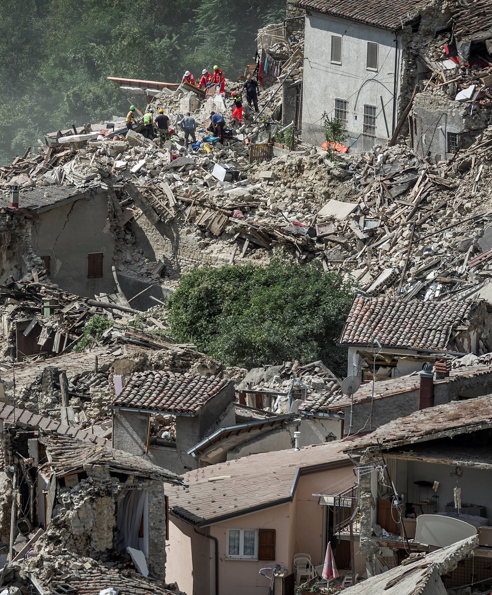 Rescuers work following an earthquake in Pescara del Tronto
