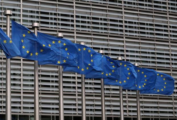 FILE PHOTO: European Union flags fly near the European Commission headquarters in Brussels