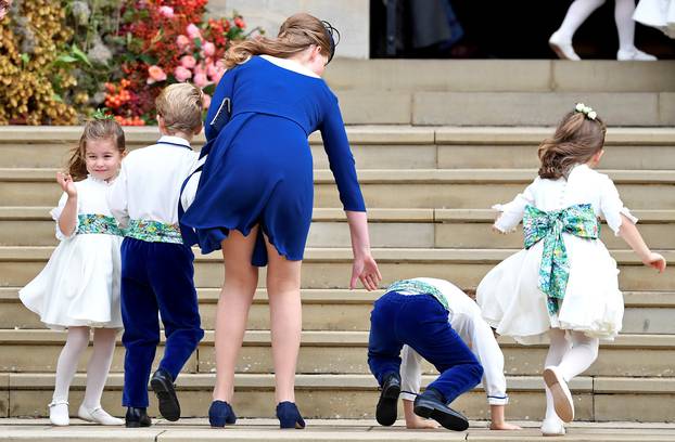 Princess Charlotte of Cambridge arrives with bridesmaids and pageboys for the royal wedding of Princess Eugenie and Jack Brooksbank at St George