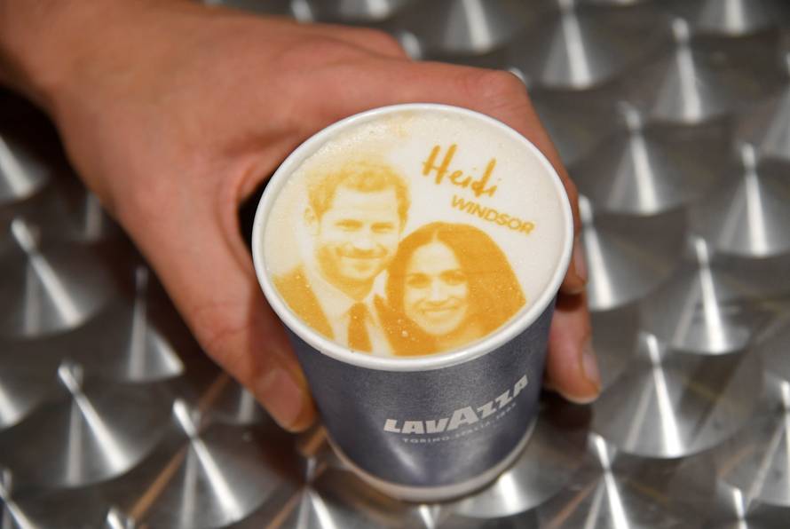 An image of Britain's Prince Harry and his fiancee Meghan Markle is seen on top of a cup of coffee being sold ahead of their forthcoming wedding in Windsor, Britain