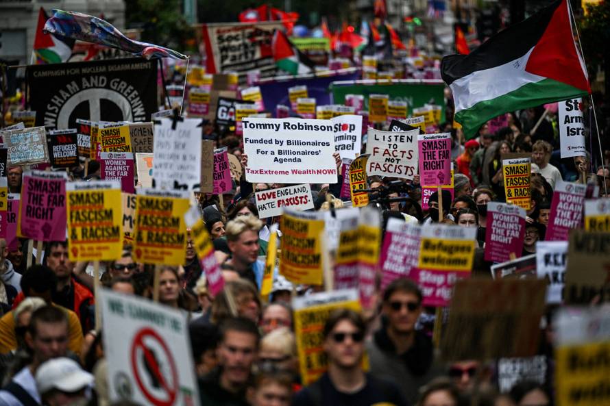 Anti-racism protesters gather to counter anti-immigration rally led by Tommy Robinson, in London