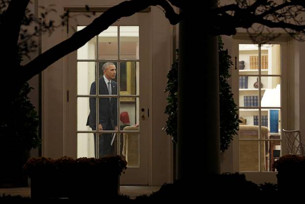 U.S. President Barack Obama stands in the Oval Office of the White House 