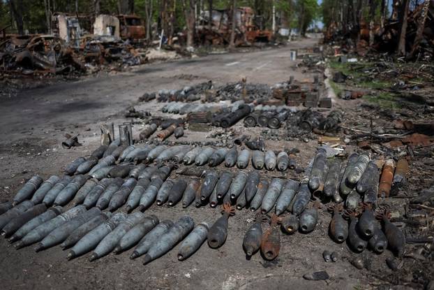 Projectiles and destroyed military vehicles are seen at an airfield in the town of Hostomel