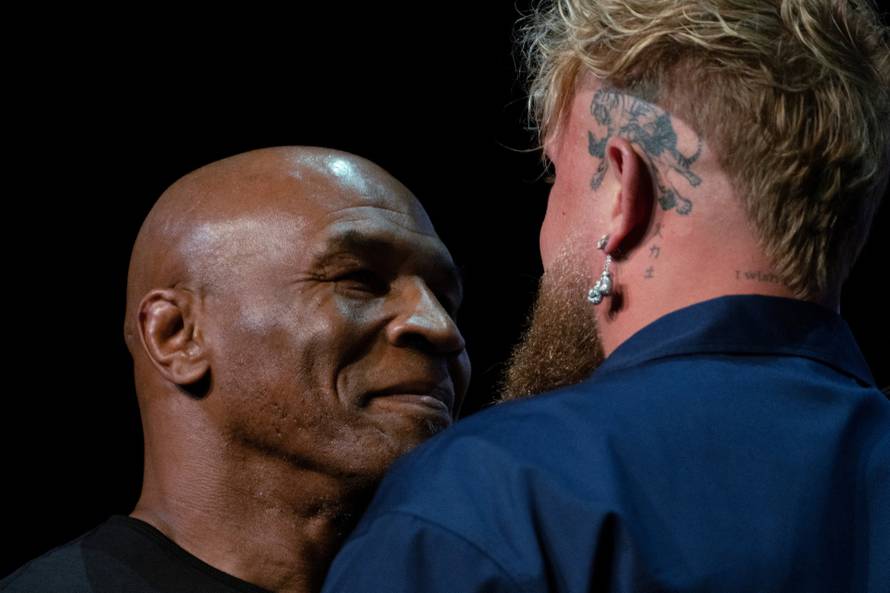 Boxers Mike Tyson and Jake Paul attend a news conference in New York