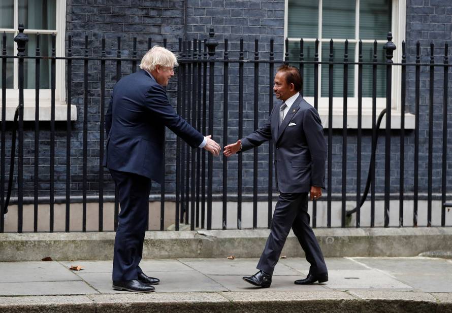 Britain's Prime Minister Boris Johnson meets Brunei's Sultan Hassanal Bolkiah, at Downing Street in London