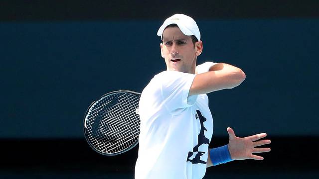 Novak Djokovic practices on court ahead of 2022 Australian Open