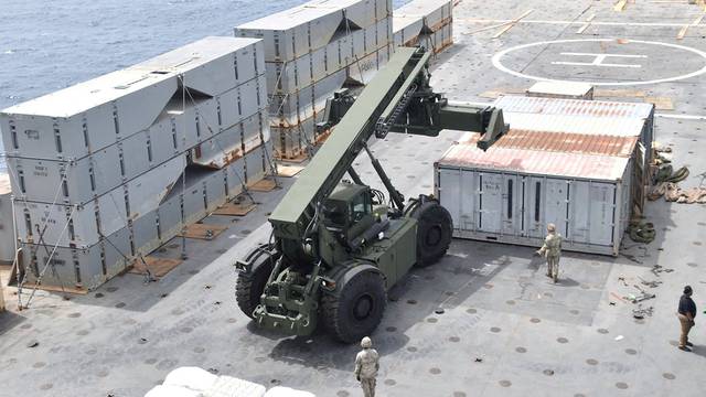 FILE PHOTO: U.S. Navy personnel construct a JLOTS to assist aid to Gaza in the Mediterranean Sea