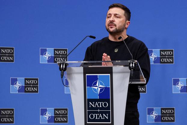 FILE PHOTO: Ukraine's President Volodymyr Zelenskiy attends a press conference, in Brussels