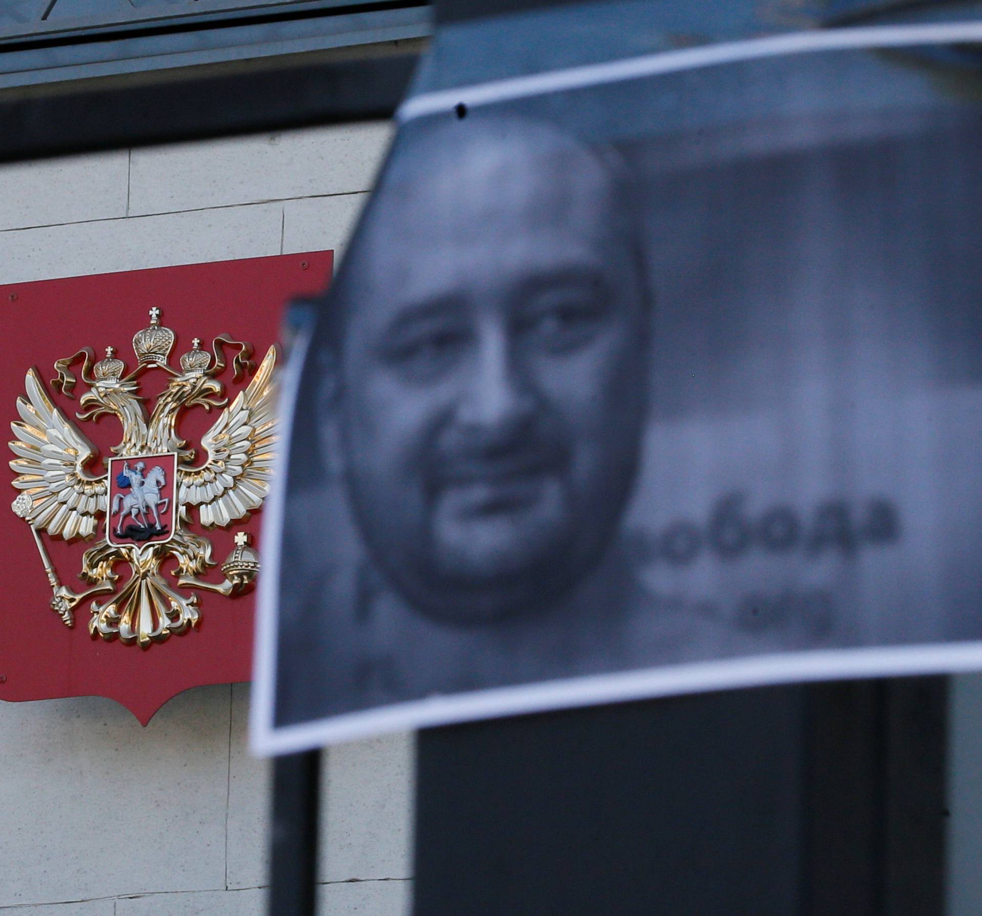 A picture of Russian dissident journalist Babchenko, who was shot dead in the Ukrainian capital on May 29, hangs from a fence of the Russian embassy in Kiev