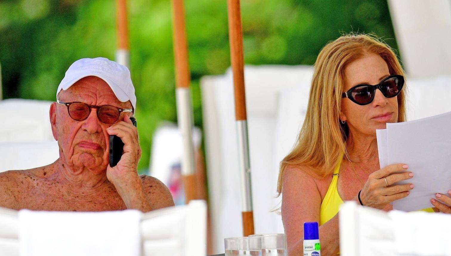 *PREMIUM-EXCLUSIVE* *MUST CALL FOR PRICING* The Australian-American business magnate Rupert Murdoch laps up the hot Caribbean sunshine with his scantily-clad mystery woman and billionaire pal Anthony Bamford out on the beaches of Barbados.