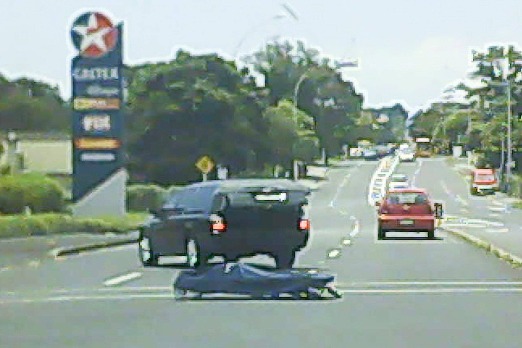 HEARSE LOSES BODY BAG