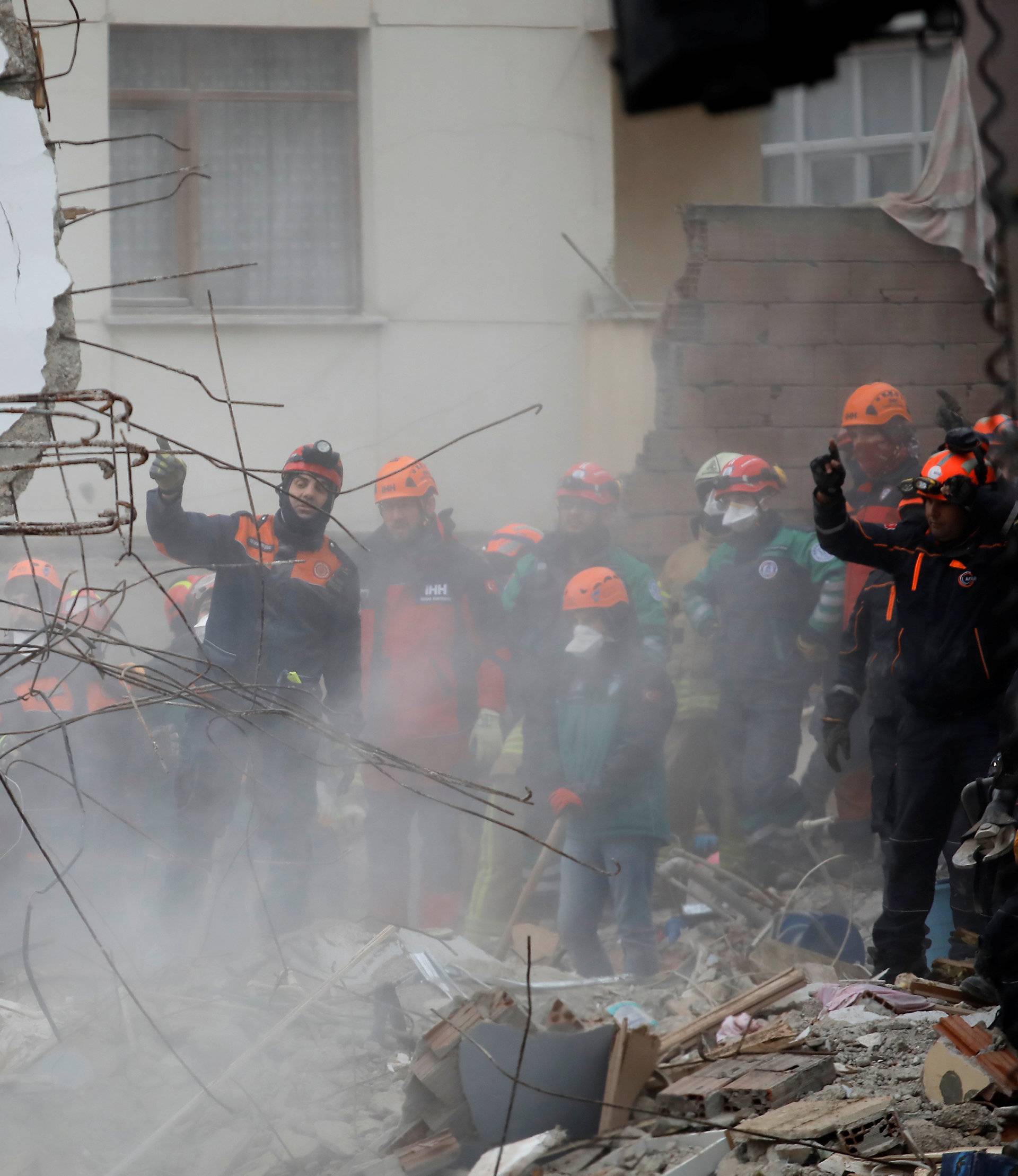 Rescue workers are seen at the site of a collapsed residential building in the Kartal district, Istanbul