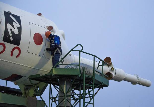 A specialist prepares the Soyuz MS-20 spacecraft for the new International Space Station (ISS) crew at the launchpad ahead of its upcoming launch, at the Baikonur Cosmodrome