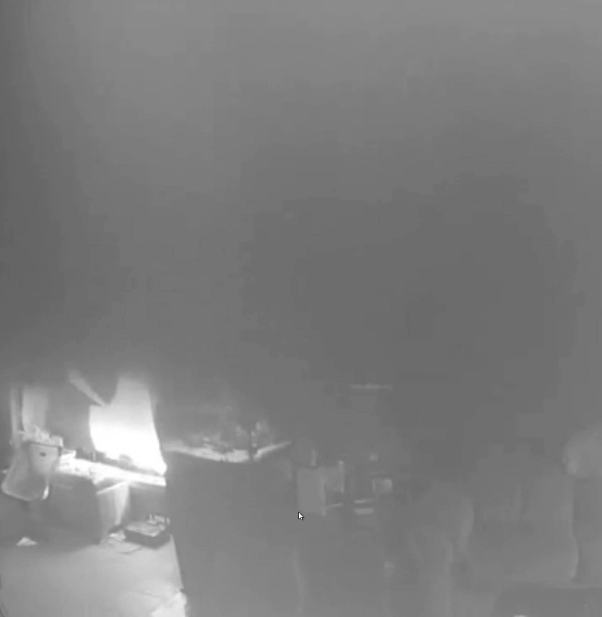 A still image captured from surveillance video footage shows wildfire engulfing the home of James O'Reilly in Fort McMurray Alberta