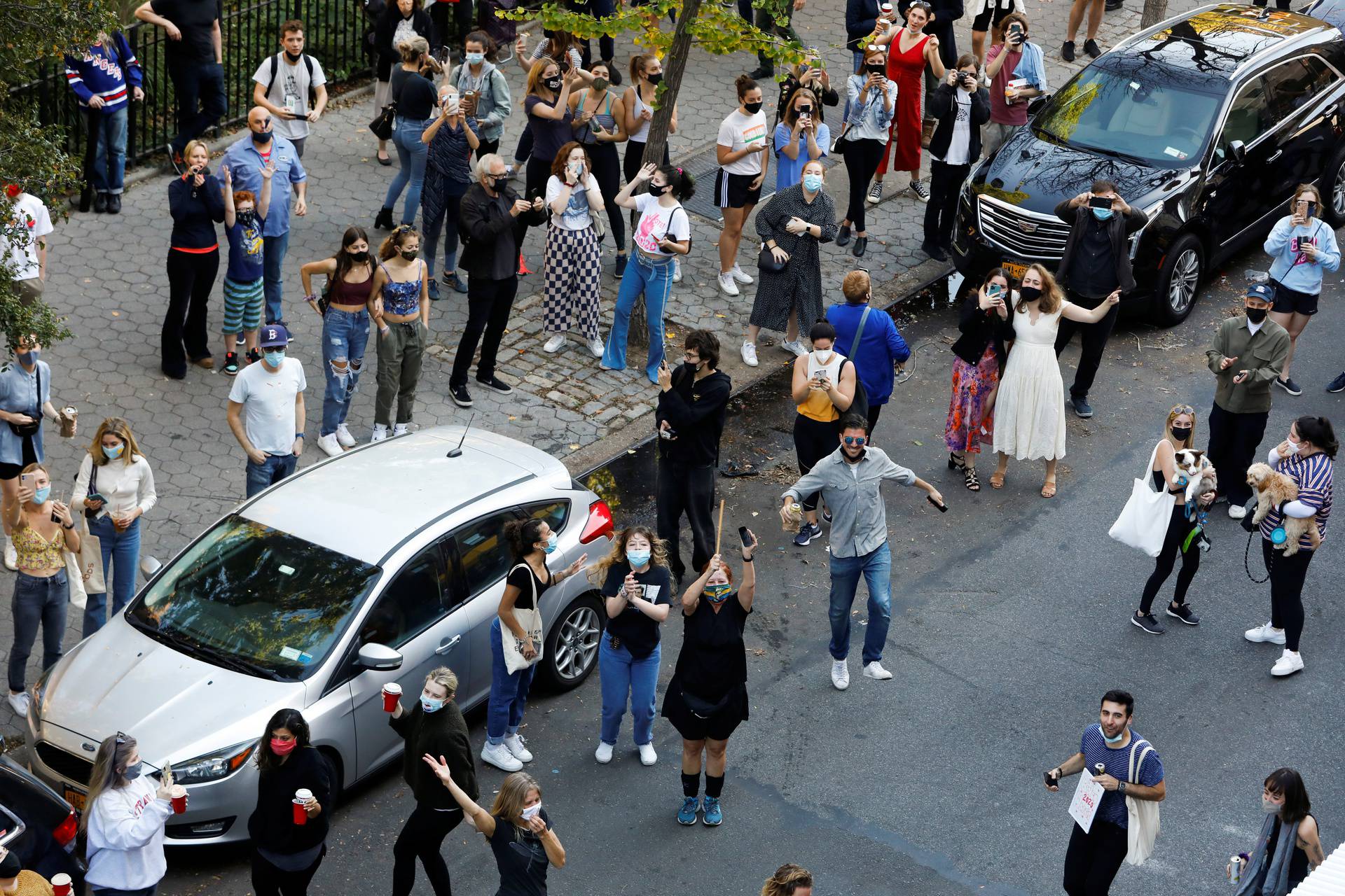 People celebrate media announcing that Democratic U.S. presidential nominee Joe Biden has won the 2020 U.S. presidential election in the Alphabet City neighborhood of Manhattan