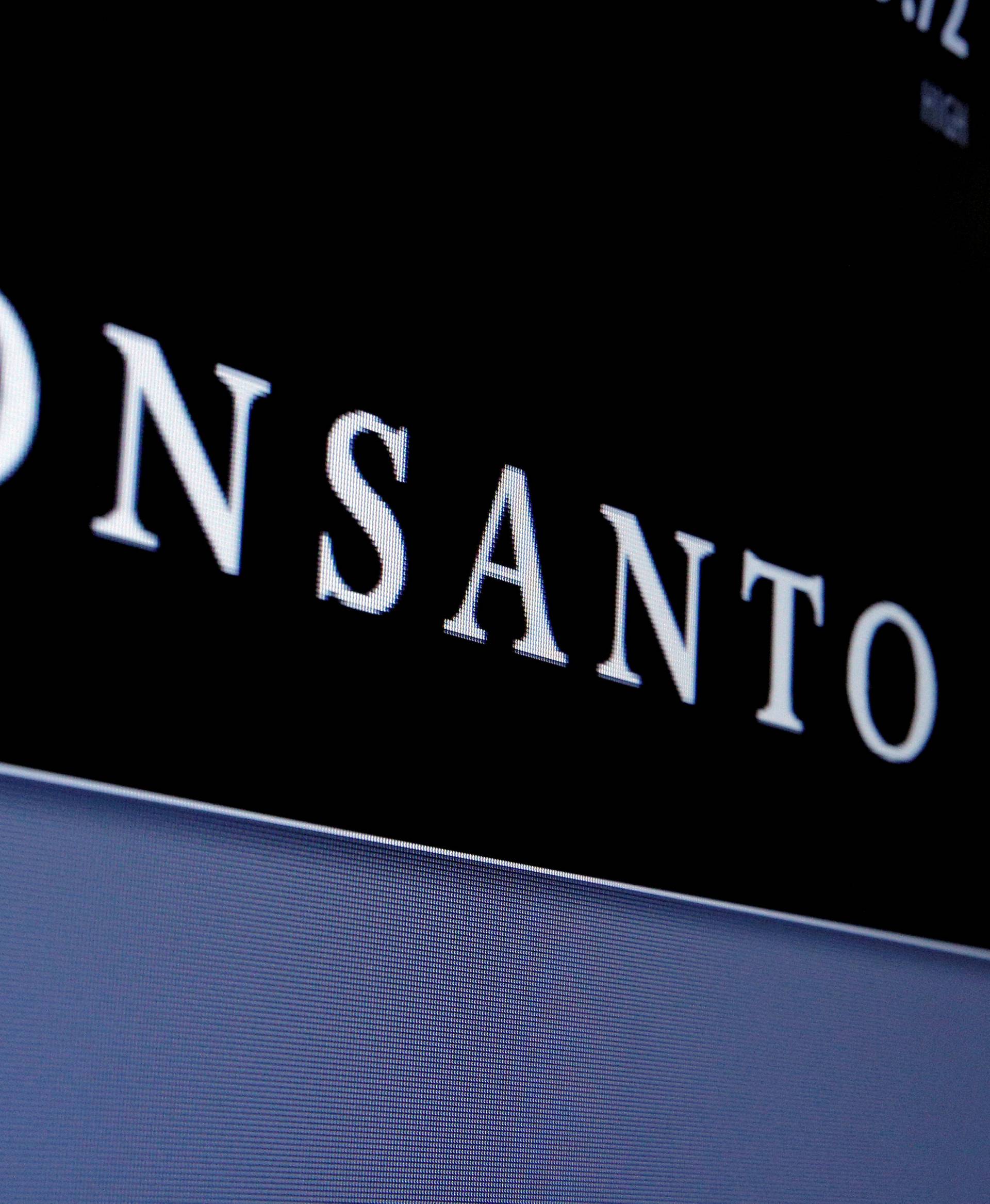 Monsanto logo is displayed on a screen where the stock is traded on the floor of the NYSE