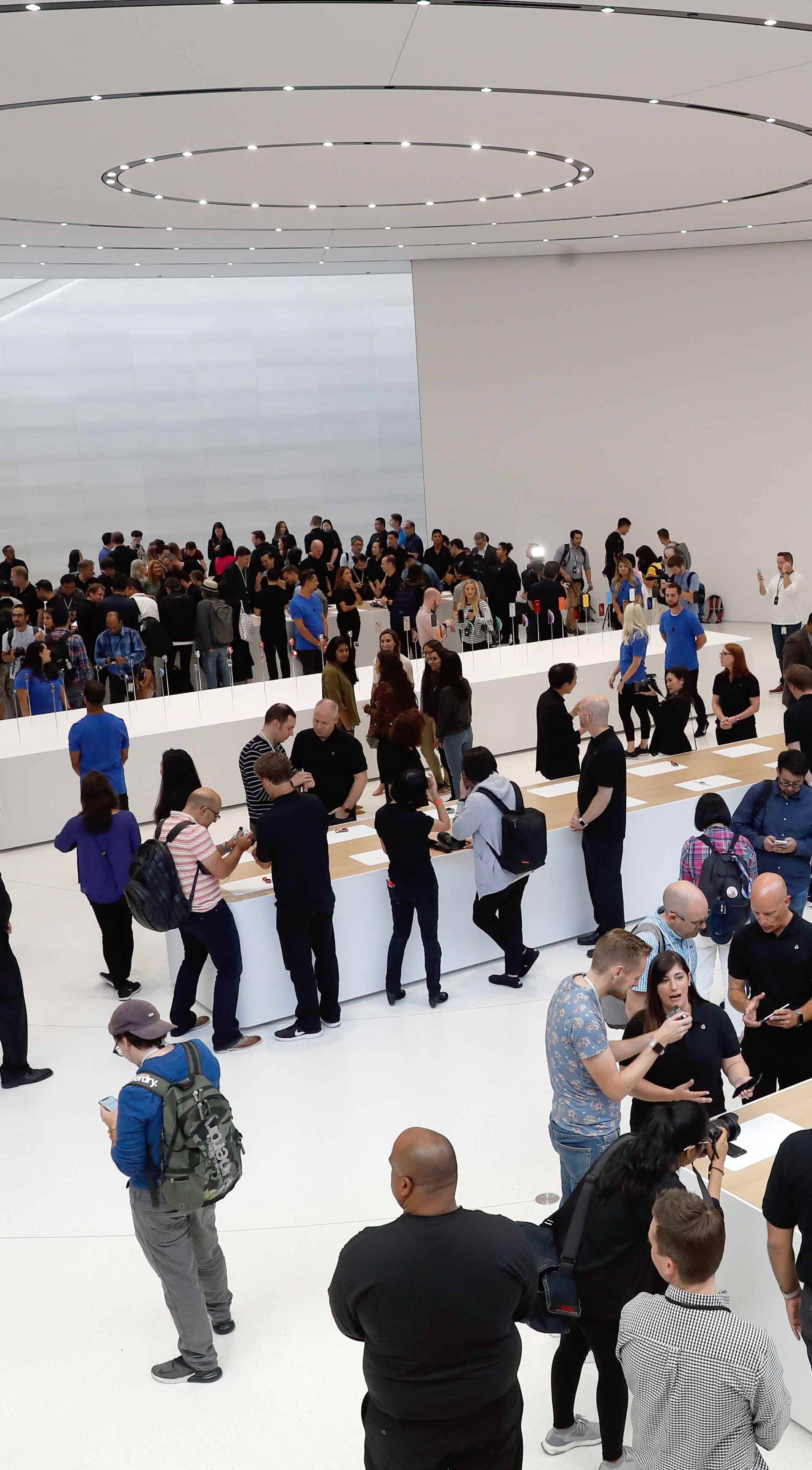 A demonstration of the newly released Apple products is seen following the product launch event in Cupertino